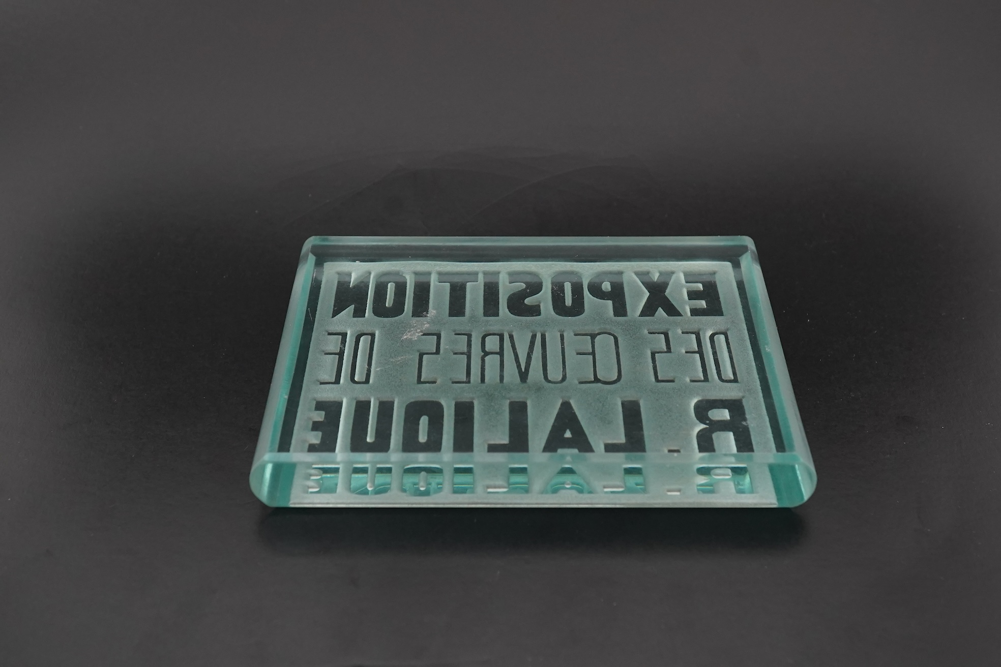 Lalique: A glass advertising plaque 'EXPOSITION DES ŒUVRES DE R.LALIQUE'